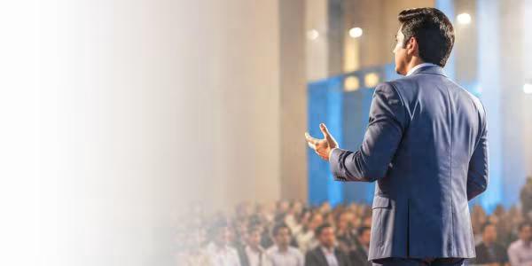 Tousif Akram speaking on stage